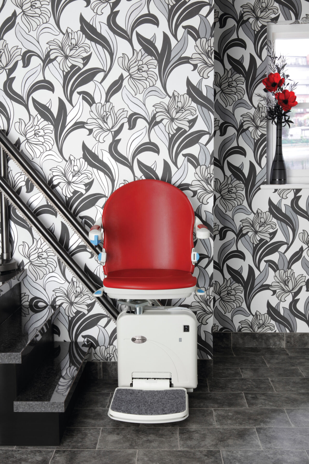 Straight Stairlift with red upholstery.