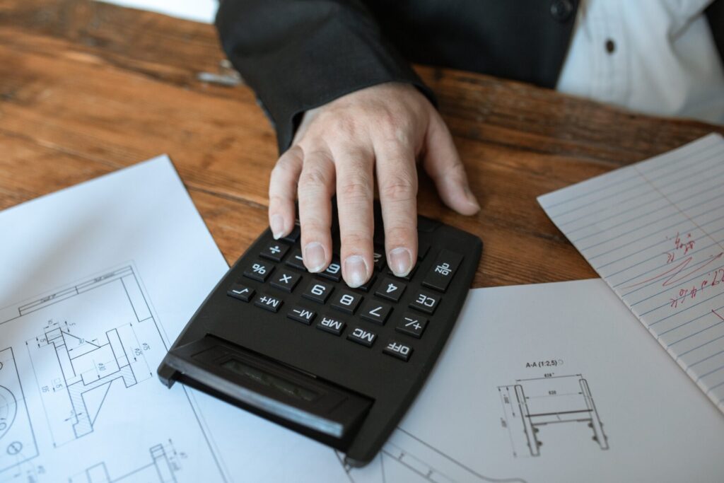 A man using a calculator.