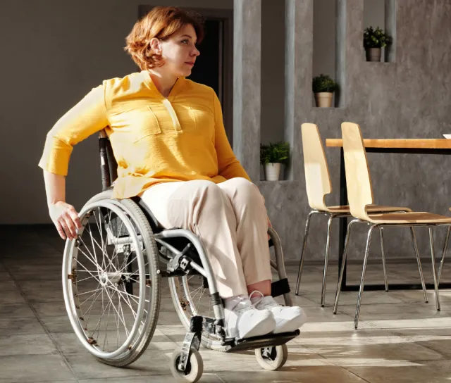 A disabled woman in a wheelchair friendly home