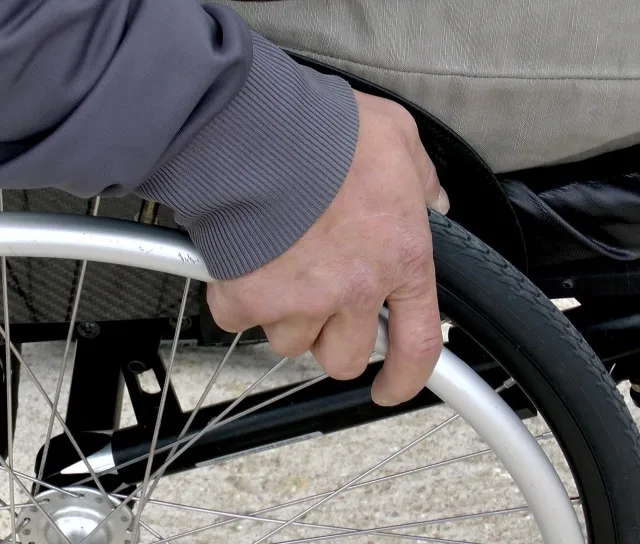 A man uses a wheelchair.