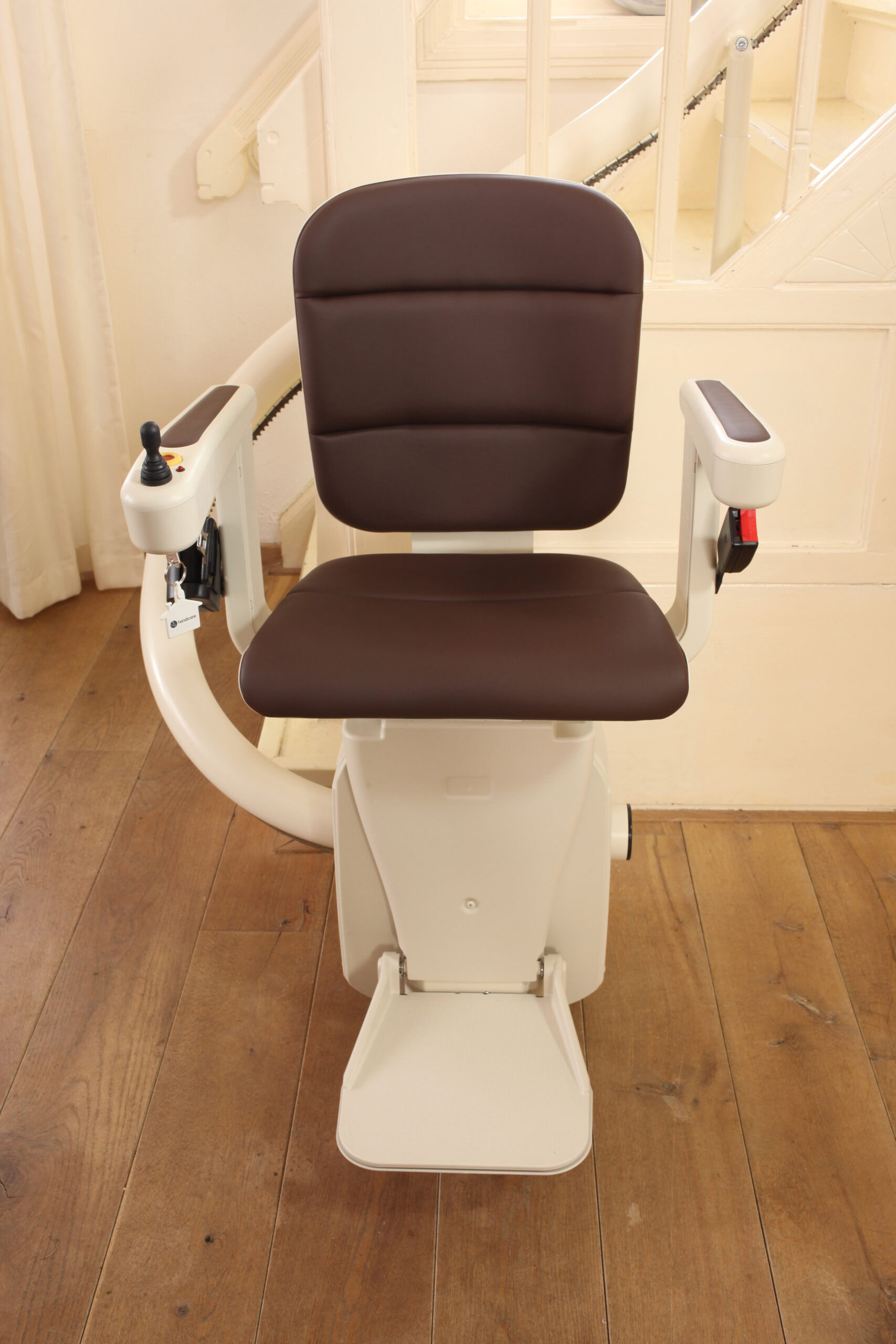 Elegance Stairlift with cocoa brown upholstery.