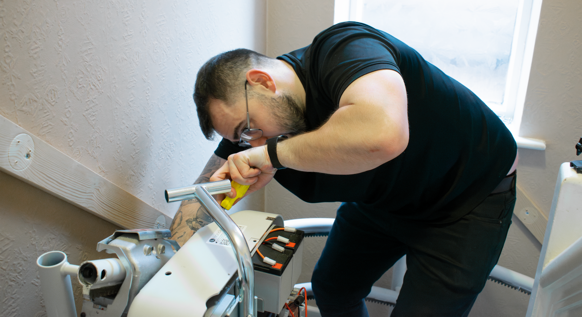 Stairlift technician Installing a Stairlift.