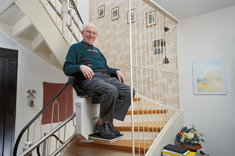 elderly man in a stairlift