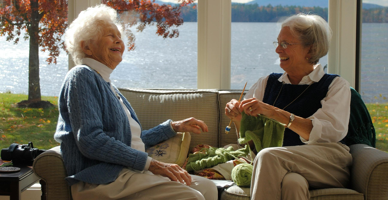 Two senior ladies discussing cheaper stairlift alternatives