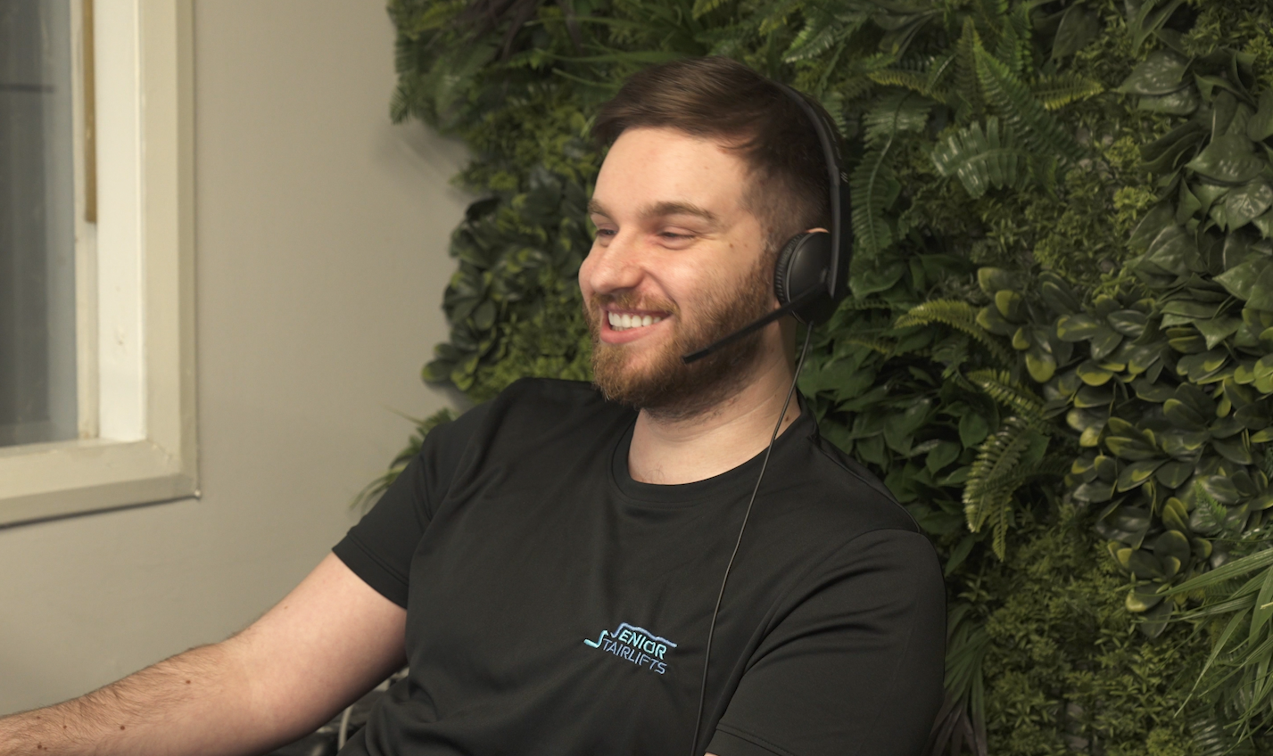 Senior Stairlifts Customer service representative happily talking to a polite customer