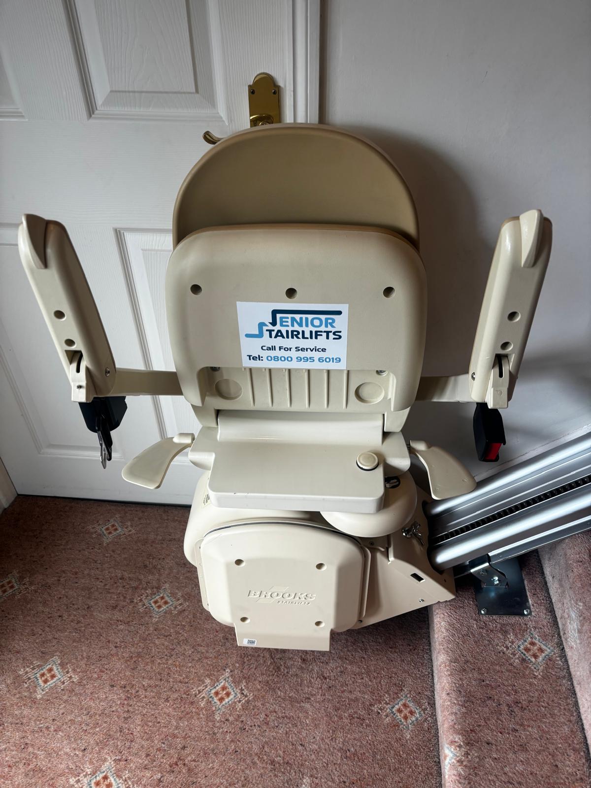 A brooks 130 stairlift installed by senior stairlift in a resting position