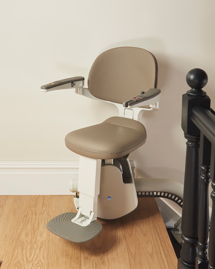 A flow X straight stairlift with cream brown furniture