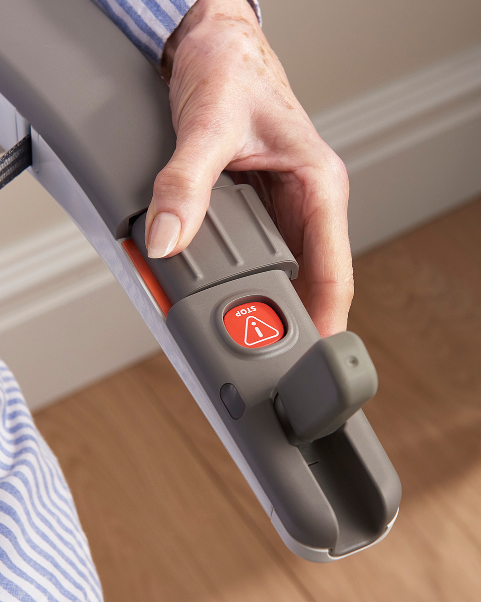 A reconditioned Flow X stairlift's emegency call button & fold away joystick